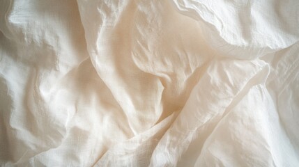Obraz premium Soft white crumpled cotton fabric, illuminated by gentle, diffused light