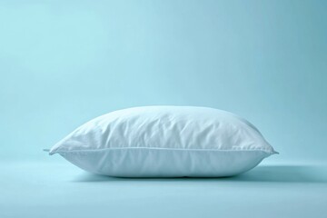 A White Pillow on a Blue Background Displaying Simple Comfort