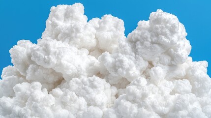 Fluffy white clouds against a blue sky; weather, nature background