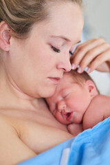 Baby birth, mother and skin with newborn in hospital for vital stability, bonding and attachment. Woman, infant and comfort new life on bed with sleeping, security or connection for child development