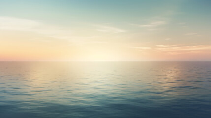 Obraz premium The ocean is calm and peaceful, with a beautiful sunset in the background