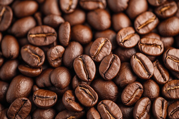 A close up of coffee beans with the beans being of different sizes