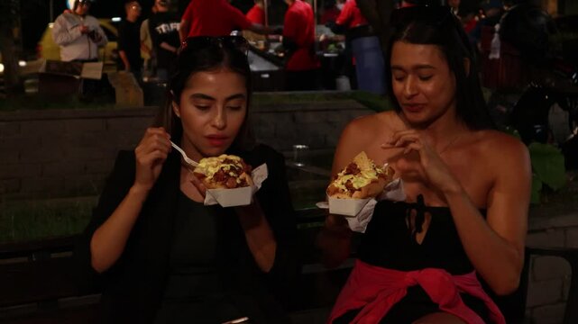 Video of two girls eating on the street