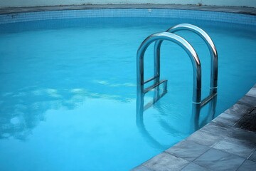 Obraz premium Swimming Pool Ladder Reflections Tranquil Water Escape Relaxation Leisure Fitness Resort