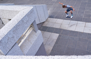 City, jump and man with skateboard, game and skills for street skating, trick or stunt for...