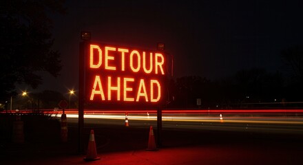 Detour Ahead Sign at Night with Traffic Light Trails