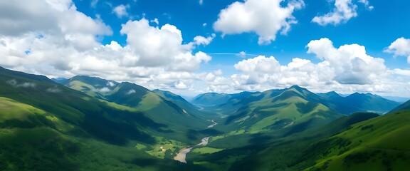 Stunning Aerial View of Lush Green Mountains and Serene River Valley under a Bright Blue Sky with Fluffy Clouds