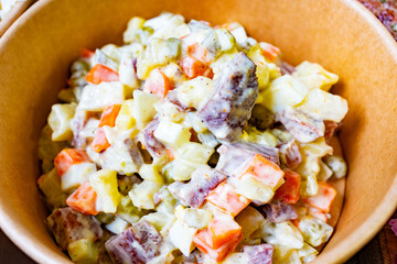 Salad made with diced vegetables in creamy dressing