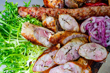 Succulent grilled meats served with fresh greens and onions