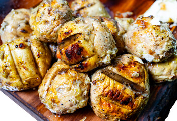 Savory grilled mushrooms served on a wooden platter