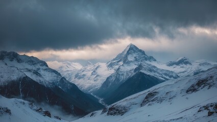 stunning view of snowy mountain peaks under a distant cloudy sky