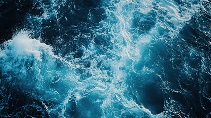 Obraz premium Serene blue ocean waves under a bright sun, high-contrast water surface, tranquil seascape with natural beauty.