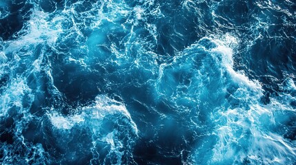 Obraz premium Serene blue ocean waves under a bright sun, high-contrast water surface, tranquil seascape with natural beauty.