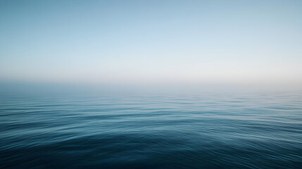 Obraz premium scene of calm sea water with a faint mist hovering just above the surface, blending into the horizon 