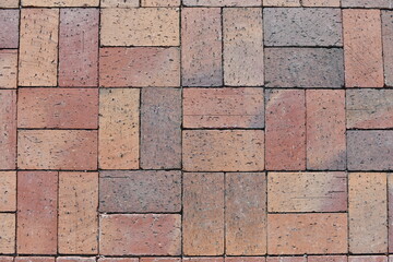 Obraz premium Multi colored red brick sidewalk.