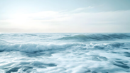 Fototapeta premium sea waves under a bright sky, with the horizon barely visible in the distance, creating a tranquil feeling 