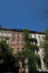 Fototapeta premium Charming Greenwich Village building in the heart of New York City, showcasing classic architecture and the vibrant character of one of NYC's most iconic neighborhoods.