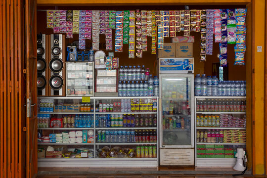 Sragen - Indonesia, April 12, 2025 : View of grocery traders in local shop or called kiosk that sells many kinds of snacks, beverages and cigarettes located on Sragen, Central Java