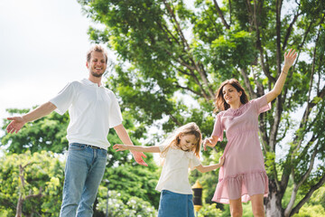Fototapeta premium Happy family parent children having picnic outdoor activity. Enjoy happiness moment summer playing together including father mother son and daughter relaxing in the morning sunrise.