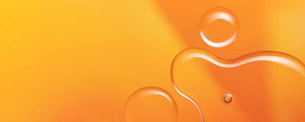 Vitamin C serum oil texture background. Liquid drops on bright orange yellow background