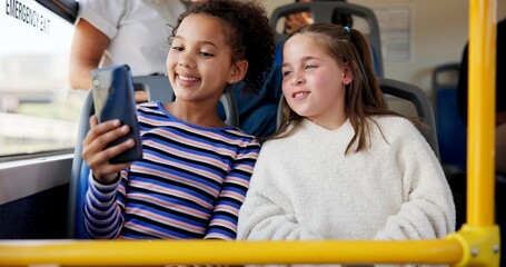 Children, friends and travel on transport with selfie for happy memory, school trip and education adventure. Girls, students and smile with photography on bus for morning commute or social media post