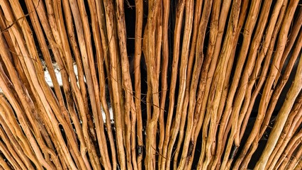 Roof Decoration from Rustic Tree Branches arranged in a visually appealing pattern creating a...
