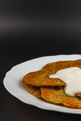 Crispy potato pancakes with creamy dressing for a tasty meal