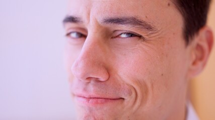Obraz premium Close up portrait of confident businessman smiling subtly