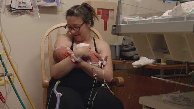 Mother Holding New Born at NICU