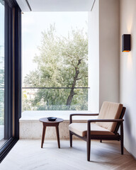 Obraz premium Cozy interior corner with modern chair and outdoor view of greenery