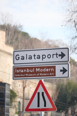Obraz premium Directional signs for Galataport and Istanbul Modern museum in Turkey