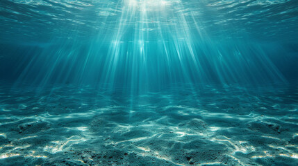 Underwater background with water and rays of sunlight shining through the surface, creating patterns on the ocean floor.