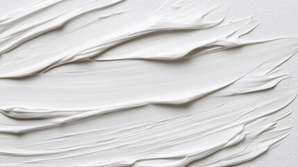 Abstract image of white paint strokes on a textured surface. The paint is thick and has a wavy texture. The background is a light gray. The overall