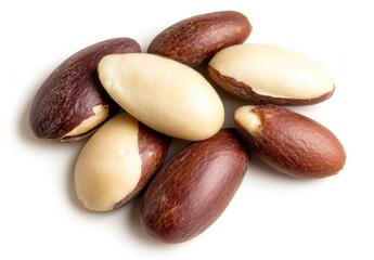 Obraz premium Close up view of several brown and beige brazil nuts arranged on a white background. The nuts are oblong and show variations in color and texture