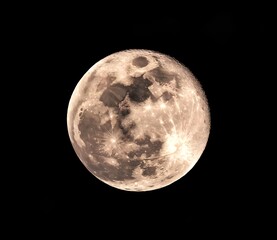 Fototapeta premium Full moon isolated on black background