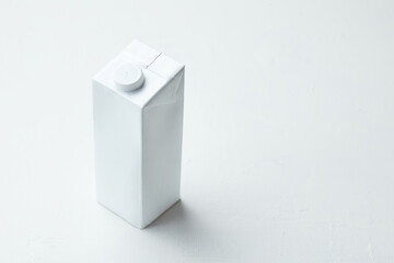 Fototapeta premium Simple White Carton on a Clean Surface With a Modern Design in Natural Light