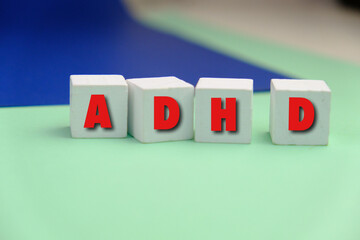 Obraz premium ADHD word alphabet letters on puzzle as a background. ADHD stands for Attention deficit hyperactivity disorder