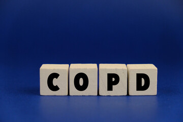 Wooden block form the word COPD. Medical concept. chronic obstructive pulmonary disease
