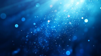 Fototapeta premium Abstract background featuring soft, defocused blue bokeh lights