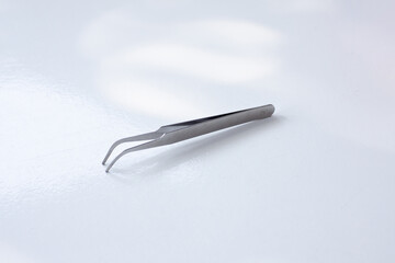 Tweezers or Electronics Tweezers are hand tools used to clamp small objects, usually to clamp nuts and bolts