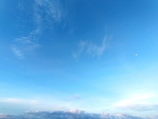 Blue sky with white clouds, a serene and
peaceful natural landscape perfect for
backgrounds and designs. Sunny daytime
setting.