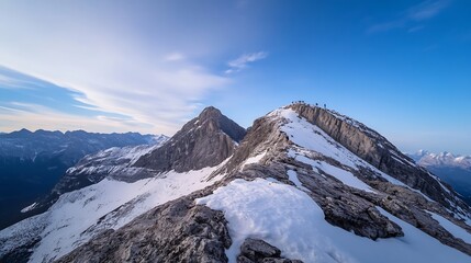 Obraz premium Breathtaking mountain landscape showcasing snow-capped peaks against a clear blue sky perfect for adventure enthusiasts : Generative AI