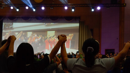 Hands, crowd or audience or music festival at night for a party or event of celebration together. Concert, disco or dance with a group of people outdoor at a carnival for performance or entertainment.