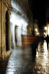 Obraz premium Motion Blur of Pedestrians Walking in a Nighttime Urban Setting : Generative AI