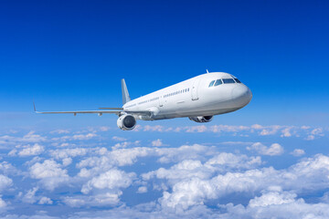 Beautiful view of clouds and passenger plane flying at high altitude, in the daytime sky overcast, cloudscape.