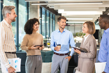 Group of happy progressive business people working on startup together at creative office