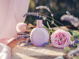 Delicate Pink Perfume Bottle Surrounded by Roses and Lavender