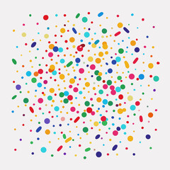 Colorful confetti scattered on white background.