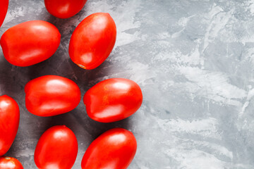 Healthy Organic Tomatoes on Concrete Surface for Farm-to-Table Salad Ingredients, Copy Space