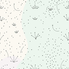 small black dots and crowns scattered across a light blue background.